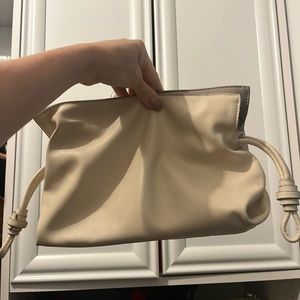 Beige handbag with gold shoulder strap